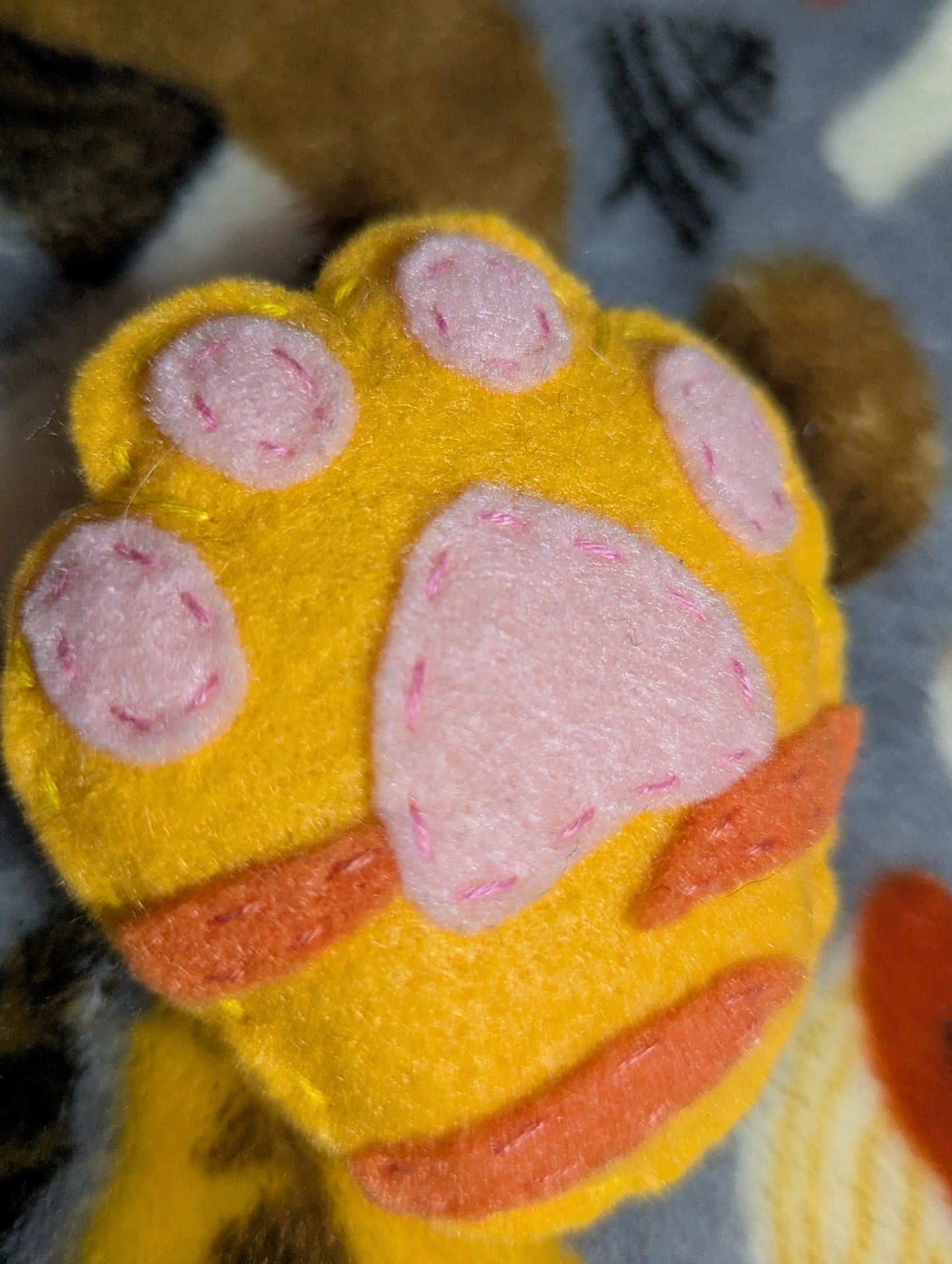 Plush Orange Cat Paw Pin